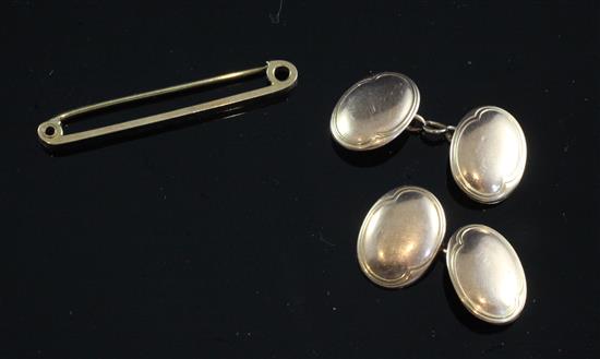 A cased pair of 9ct gold oval cufflinks and a 9ct gold tie pin,